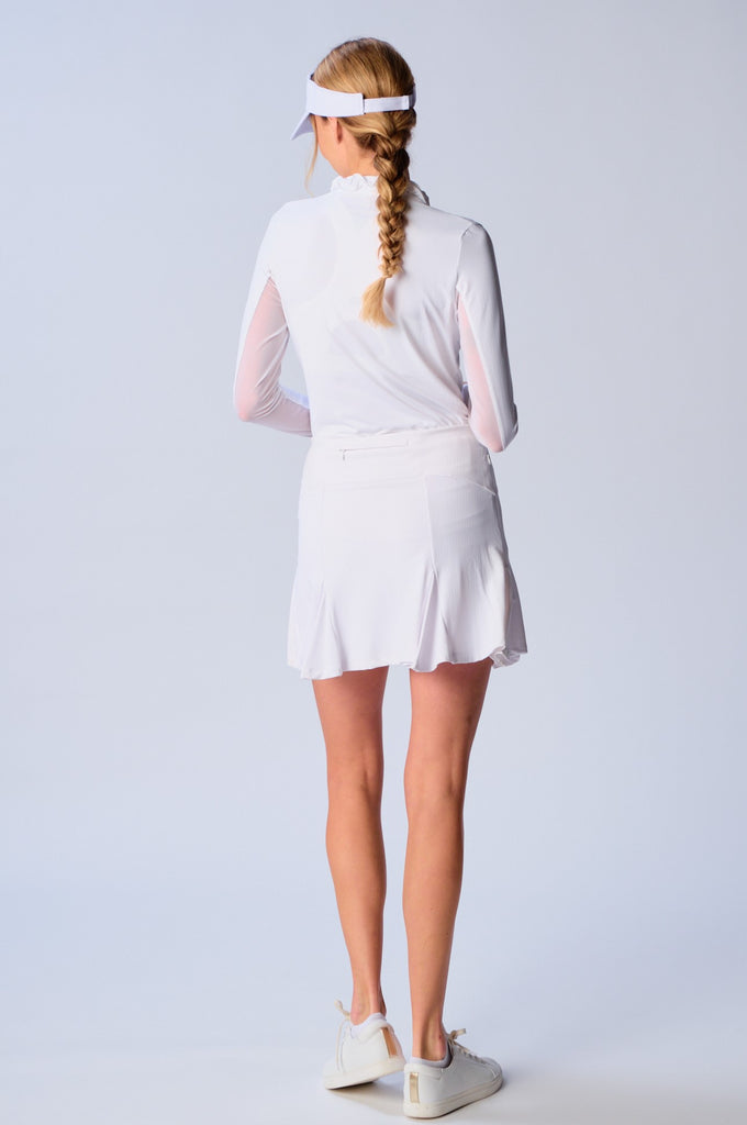 The image showcases the back view of the G Lifestyle Flare Godet Skort in White. The skort waistband is flat and wide with a single horizontal utility pocket with zip closure. The subtle texture of the soft stretchy fabric is noticeable. The stitching is meticulous, ensuring a durable and comfortable fit. This skort is suitable for tennis, pickleball, padel tennis, golf. 